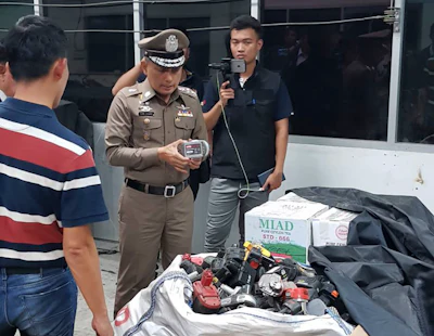 In this photo taken Thursday, May 24, 2018, and released by the Royal Thai Police, a factory processing electronic waste is visited by police in Lat Krabang, outside Bangkok, Thailand. Police have raided several factories near Bangkok that allegedly were processing illegally imported electronic waste in a sign that China’s crackdown on waste recycling is pushing such operations offshore.