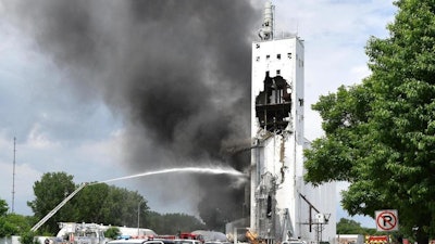Emergency workers respond to the scene of a grain elevator explosion and fire near the intersection 4th Avenue and West 24th Street in South Sioux City, Neb., Tuesday, May 29, 2018.