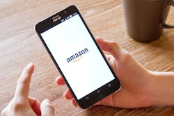 Man Hand Holding Screen Shot Of Amazon Application 588359470 2125x1416