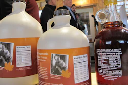 Containers of maple syrup, with nutrition facts on their labels are lined up on a table at Morse Farm Sugarworks in East Montpelier, Vt., Tuesday, May, 1, 2018. Maple syrup and honey producers aren't too sweet on a plan to label their natural products as containing added sugars. The FDA plans to require updated nutrition labels for products that would say that pure maple syrup and honey contain added sugars.