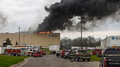 Emergency personnel respond to a fire at Meridian Magnesium Products of America in Eaton Rapids, Mich., Wednesday morning, May 2, 2018. Authorities said explosions and a large fire at the auto parts plant injured a couple people and forced the evacuation of workers.