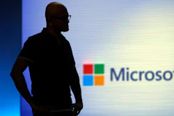 Microsoft CEO Satya Nadella looks on during a video as he delivers the keynote address at Build, the company's annual conference for software developers Monday, May 7, 2018, in Seattle.