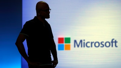 Microsoft CEO Satya Nadella looks on during a video as he delivers the keynote address at Build, the company's annual conference for software developers Monday, May 7, 2018, in Seattle.