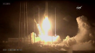 In this photo made from NASA video, the Orbital/ATK Cygnus CRS-9 sits on top of an Antares rocket as it launches from NASA's Wallops Flight Facility, Monday morning, May 21, 2018, in Virginia.