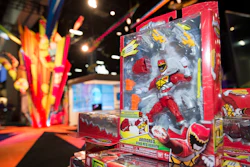 In this July 8, 2015, file photo, a Power Rangers figure sits on display at a booth before Preview Night at Comic-Con International held at the San Diego Convention Center in San Diego. Hasbro is buying the Power Rangers and some other toy brands from Saban Properties in a cash-and-stock deal valued at about $522 million.