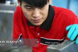 Star Rapid technician checks a plastic injection mold tool before installation.