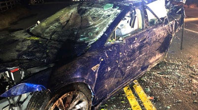 This photo provided by NBC Bay Area-KNTV shows a Tesla car after it was pulled from a pond near the city of San Ramon, Calif., on Monday, May 21, 2018. Authorities in the San Francisco Bay Area are investigating the death of a man after the Tesla car he was driving veered off a road, crashed through a fence and into a pond.