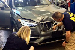 In this March 20, 2018, file photo provided by the National Transportation Safety Board, investigators examine a driverless Uber SUV that fatally struck a woman in Tempe, Ariz. Uber announced Wednesday, May 23, that it is pulling its self-driving cars out of Arizona, a reversal triggered by the recent death of woman who was run over by one of the ride-hailing service's robotic vehicles while crossing a darkened street in a Phoenix suburb.