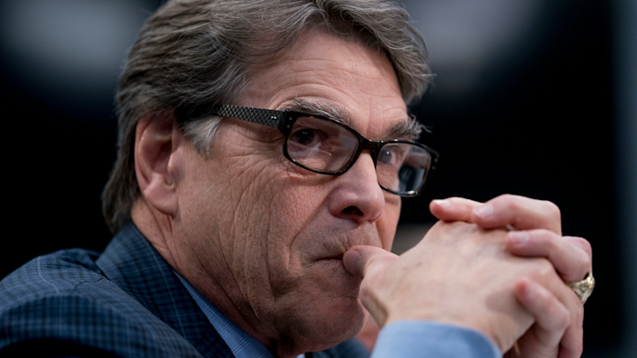 In this March 15, 2018 photo, Energy Secretary Rick Perry appears before a House Appropriations subcommittee hearing on Capitol Hill in Washington. Perry is defending President Donald Trump's call to bolster struggling coal-fired and nuclear power plants, saying a rash of plant retirements is 'alarming' and poses a looming crisis.