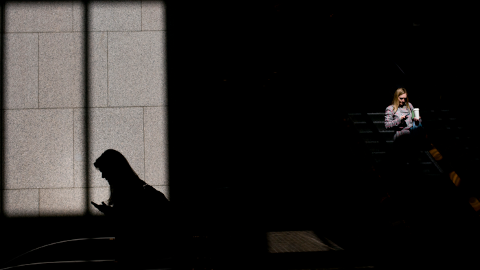 In this June 1, 2018, file photo, commuters look at their phones in Los Angeles. Technology giants like Facebook, Google and Amazon ask us to trust them with ever-more sensitive aspects of our lives, from our relationships to our private conversations. But there’s a catch: If they prove unworthy of that trust, the repercussions are scant and alternatives seem hard to find.