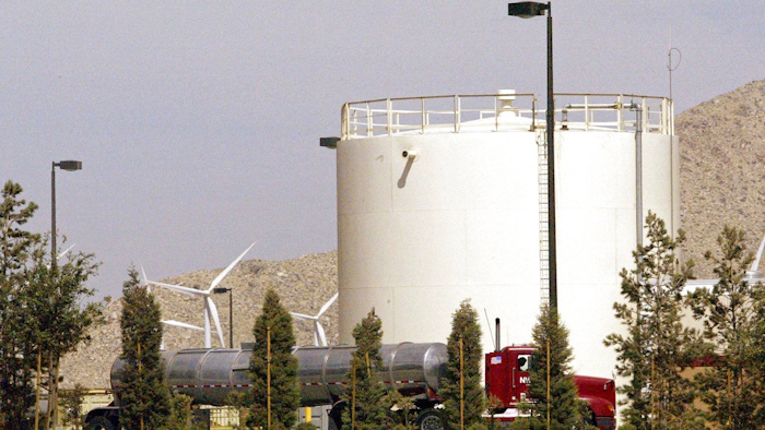 In this July, 7, 2004, file photo, a storage tank is seen at the Arrowhead Mountain Water Company bottling plant, owned by Swiss conglomerate Nestle, on the Morongo Indian Reservation near Cabazon, Calif. Nestle has been offered a three-year permit to keep taking millions of gallons of water from Southern California's San Bernardino National Forest, but with new restrictions designed to keep a creek flowing for other uses. The offer announced Wednesday, June 27, 2018, by the U.S. Forest Service allows the maker of Arrowhead bottled water to continue piping water from the Strawberry Creek watershed as it has done for decades.