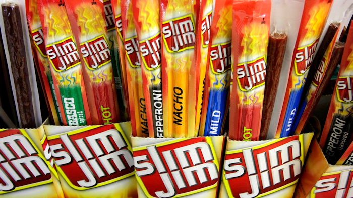 In this March 24, 2010, file photo, Slim Jim beef sticks stand on a shelf at a Shell gas station mini-mart in Bainbridge Twp., Ohio. Conagra, which has brands such as Slim Jim and Reddi-wip, is buying Pinnacle Foods Inc. in a cash-and-stock deal valued at about $10.9 billion that will help the food company expand in the frozen food and snacks categories.