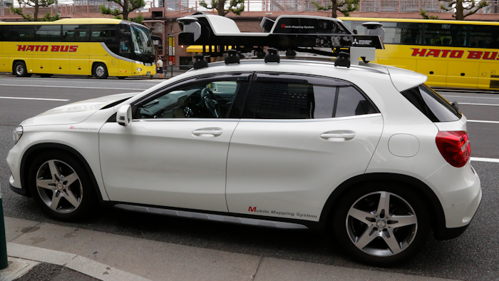 In this May 31, 2018, photo, a car is equipped with sensors to create 3D digital mapping in Tokyo. Technology companies are racing to develop ultra-precise three-dimensional digital maps that can guide self-driving cars to within inches of where they are supposed to be _ a hurdle the industry needs to clear if it hopes to deliver on its promise of widespread use of driverless vehicles.