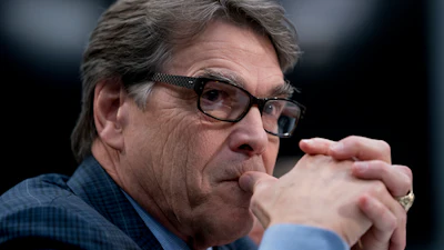 In this March 15, 2018 photo, Energy Secretary Rick Perry appears before a House Appropriations subcommittee hearing on Capitol Hill in Washington. Perry is defending President Donald Trump's call to bolster struggling coal-fired and nuclear power plants, saying a rash of plant retirements is 'alarming' and poses a looming crisis.