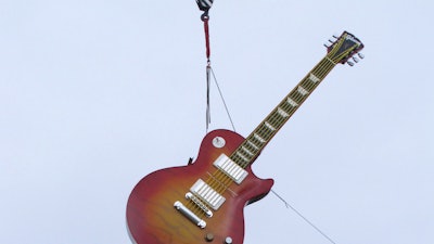 A large guitar replica is lifted into place as a street marker on Thursday, June 21, 2018, a few blocks away from where the Hard Rock Casino will open in Atlantic City, N.J., on June 28. The sign was installed on the same day that a different casino also opening on June 28, the Ocean Resort Casino, was granted a casino license by New Jersey gambling regulators.