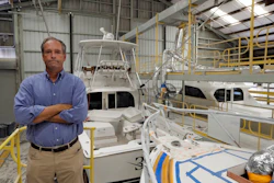 Peter Truslow, Chief Executive Officer for Bertram, a boat building company, poses near three of his custom made boats Friday, June 22, 2018, in Tampa, Fla.