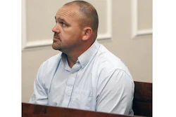 In a May 22, 2015 file photo, Gilbert 'Toby' Curtsinger sits Franklin County Circuit Court in Frankfort, Ky. Curtsinger, the ringleader of a whiskey theft operation in Kentucky was sentenced to 15 years in prison Friday, June 1, 2018 for his role in siphoning tens of thousands of dollars' worth of bourbon from a pair of distilleries.
