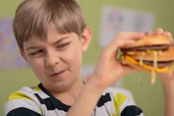 Boy Not Liking Burger