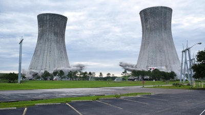Two cooling towers of the St. Johns River Power Park in Jacksonville, Fla., are simultaneously imploded Saturday, June 16, 2018, as part of the demolition of the now closed coal fired power plant operated by the Jacksonville Electrical Authority.