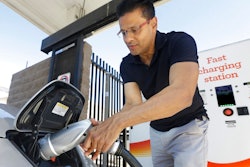 In this Sept. 17, 2015, file photo, Darshan Brahmbhatt, plugs a charger into his electric vehicle at the Sacramento Municipal Utility District charging station in Sacramento, Calif. California utilities will invest nearly $768 million to expand a network of charging stations and other infrastructure for electric vehicles as the state moves toward a goal of 5 million zero-emission cars on the roads by 2030. The California Public Utilities Commission voted 5-0 Thursday, May 31, 2018, to fund programs statewide, with an emphasis on building facilities in disadvantaged communities.