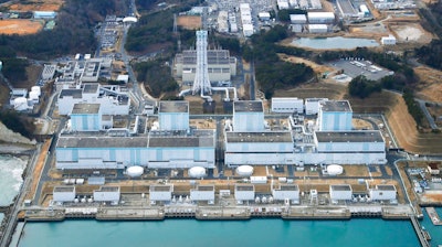 In this February 2018, aerial photo shows Fukushima Dai-ni, or No. 2, nuclear power plant in Naraha, Fukushima Prefecture, northeastern Japan. Tokyo Electric Power Company Holdings said Thursday, June 14, 2018, it was considering dismantling four reactors at the plant, which has never restarted since the 2011 disaster. If Fukushima No. 2 were to be scrapped, the number of workable reactors in Japan would fall to 35, down from 54 before the disaster.