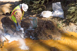 As water exits the Gold King mine, it flows into a system of four treatment ponds. The treatment ponds provide retention time to allow the pH to adjust. Here, lime is added to a settling pond to assist in the pH adjustment of the water prior to discharge to Cement Creek on Aug 14, 2015.