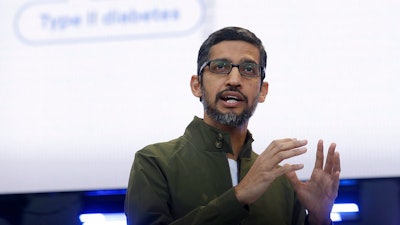 n this May 8, 2018, file photo, Google CEO Sundar Pichai speaks at the Google I/O conference in Mountain View, Calif. Google pledges that it will not use artificial intelligence in applications related to weapons or surveillance, part of a new set of principles designed to govern how it uses AI. Those principles, released by Pichai, commit Google to building AI applications that are 'socially beneficial,' that avoid creating or reinforcing bias and that are accountable to people.