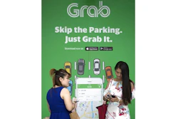 In this March 26, 2018, file photo, passengers wait for Grab car outside a shopping man in Kuala Lumpur, Malaysia. Japan's top automaker Toyota Motor Corp. is investing $1 billion in Grab, the leading ride-hailing company in Southeast Asia, the company said Wednesday, June 13, 2018.