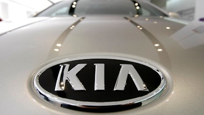 In this Jan. 28, 2011 file photo, KIA Motors logo is seen on a K7 sedan at a showroom in Seoul, South Korea. Kia is recalling over a half-million vehicles in the U.S. because the air bags may not work in a crash. The recall apparently is related to federal investigation into air bag failures in Kia and partner Hyundai vehicles that were linked to four deaths. Vehicles covered by the recall include 2010 through 2013 Forte compact cars and 2011 through 2013 Optima midsize cars. Also covered are Optima Hybrid and Sedona minivans from 2011 and 2012.