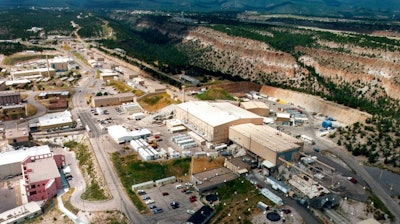 This undated file aerial photo shows the Los Alamos National laboratory in Los Alamos, N.M. The U.S. government has awarded a team of two universities and a research firm with offices around the world a $2.5 billion-a-year contract to manage Los Alamos National Laboratory.
