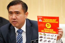 Malaysian Minister of Transport Anthony Loke speaks during a press conference in Putrajaya, Malaysia, Tuesday, June 5, 2018. Malaysia's Transport Minister says the government will take on an active role in an auto recall to replace flawed Takata air bags after data from eight car manufacturers showed that more than 350,000 car owners have not responded.