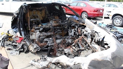 Remains of the Tesla Model S at a storage yard.