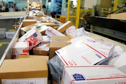 In this Dec. 14, 2017, file photo, packages travel on a conveyor belt for sorting at the main post office in Omaha, Neb. States will be able to force shoppers to pay sales tax when they make online purchases under a Supreme Court decision Thursday, June 21, 2018, that will leave shoppers with lighter wallets but is a big win for states.