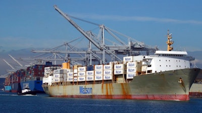 In this March 12, 2018, file photo, a tugboat assists a container ship in docking at the Port of Oakland in Oakland, Calif. President Donald Trump announced Friday, June 15, 2018, that starting next month the U.S. will impose a 25 percent tariff on up to $50 billion in Chinese imports.