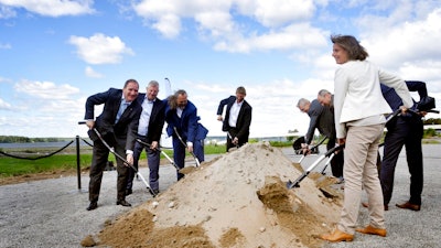 Government leaders in Sweden take part in a ceremony marking the construction of pilot plant for fossil-free steel production, a collaboration between LKAB, Vattenfall and SSAB, in the SSAB industrial area in Lulea, Sweden Wednesday June 20, 2018.