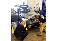 In this March 20, 2018 file photo provided by the National Transportation Safety Board, investigators examine a driverless Uber SUV that fatally struck a woman in Tempe, Ariz. An Arizona police report says the human backup driver the Uber autonomous SUV was streaming a television show on Hulu just before the vehicle struck and killed a pedestrian in March. The Arizona Republic reported that the driver was watching “The Voice,” a television musical talent show. The newspaper received the more than 300-page report from Tempe police on Thursday, June 21.