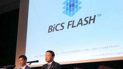Toshiba Memory President Yasuo Naruke, right, and Bain Capital Japan chief Yuji Sugimoto, left, attend their joint press conference Monday, June 4, 2018, in Tokyo. The buyers of the memory operations at Toshiba Corp. are promising to invest in technology development and manufacturing facilities to stay competitive.