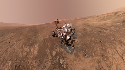 This composite image made from a series of Jan. 23, 2018 photos shows a self-portrait of NASA's Curiosity Mars rover on Vera Rubin Ridge. On Thursday, June 7, 2018, scientists said the rover found potential building blocks of life in an ancient lakebed and confirmed seasonal increases in atmospheric methane. The rover's arm which held the camera was positioned out of each of the dozens of shots which make up the mosaic.