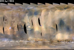 This composite image made from observations by NASA's Mars Reconnaissance Orbiter spacecraft shows a global map of Mars with a growing dust storm as of June 6, 2018. The storm was first detected on June 1. The blue dot at center indicates the approximate location of the Opportunity rover.