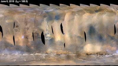This composite image made from observations by NASA's Mars Reconnaissance Orbiter spacecraft shows a global map of Mars with a growing dust storm as of June 6, 2018. The storm was first detected on June 1. The blue dot at center indicates the approximate location of the Opportunity rover.