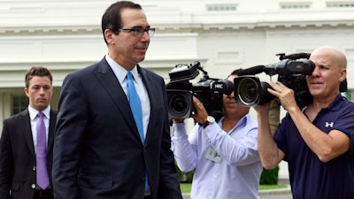 Treasury Secretary Steven Mnuchin walks out to speak with reporters at the White House in Washington, Wednesday, June 27, 2018.