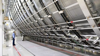 Scientist Thomas Thuemmler, stands next to the main spectrometer of the Karlsruhe Institute for Technology, near Karlsruhe Germany.