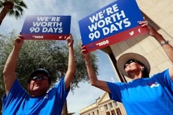 Roger Parrish and Diane Johnson, right, rally outside the Capitol in Phoenix, Wednesday, June 6, 2018. Hundreds of Navajo Generating Station employees, relatives and union and tribal leaders rallied at the state Capitol in Phoenix on Wednesday to request a 90-day pause in steps to close the coal-fueled plant by the end of 2019 as scheduled.