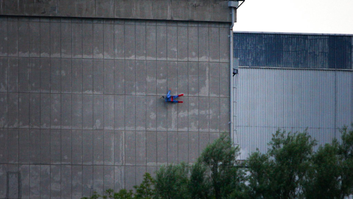 In this photo released by Greenpeace, a drone resembling the character Superman crashes into a wall of the nuclear power plant of Le Bugey, central, France, Tuesday, July 3, 2018. The environmental activist group says the drone was harmless but the action showed the lack of security in nuclear installations in France, which is heavily dependent on atomic power.