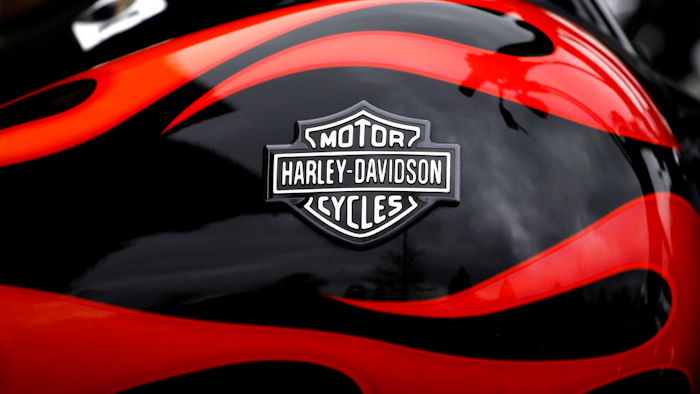 This April 27, 2017, file photo shows the Harley-Davidson name on the gas tank of a bike in Glenview, Ill. The iconic American motorcycle company, facing dwindling sales in its home market, said Monday, July 30, 2018, that it would be rolling out some new products, and stores, to broaden its audience and hopefully, invigorate sales.
