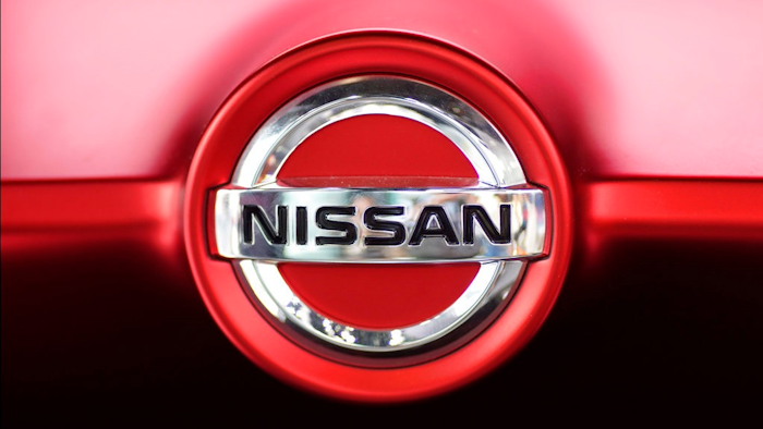 This June 14, 2018, file photo, shows a Nissan logo on a Nissan Concept 2020 Vision Gran Truismo on display at the automaker's showroom in Tokyo. Nissan Motor Co. says it has altered results of exhaust emissions and fuel economy tests of its new vehicles sold in Japan, in the latest misconduct to surface at the Japanese automaker.