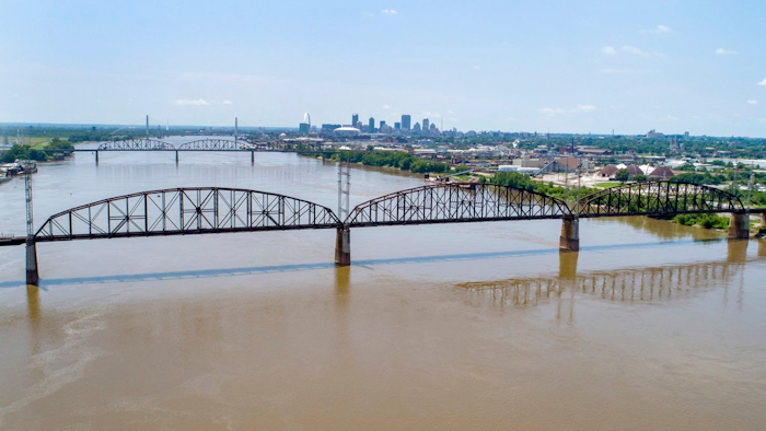 In this photo made Wednesday, June 27, 2018, the Merchants Bridge is seen in the foreground as it crosses the Mississippi River as the St. Louis skyline is seen in the distance. The 127-year-old railroad bridge is in danger of being shut down if it is not replaced soon, but officials are struggling with how to pay for a planned repair and the 12,500 tons of steel the project would require after tariffs were recently enacted.