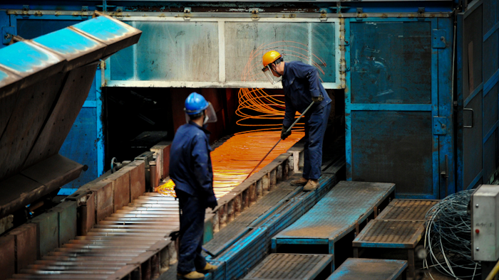 In this June 8, 2018, photo, a worker handles red hot steel cables at a steel factory in Qingdao in east China's Shandong province. The Trump administration on Monday, July 16, 2018, brought cases against China, the European Union, Canada, Mexico and Turkey at the World Trade Organization for retaliating against American tariffs on imported steel and aluminum.