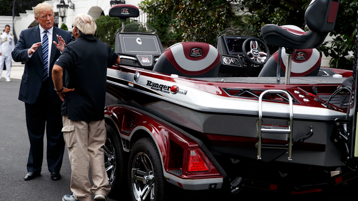 President Donald Trump talks with Jimmy Houston of Ranger Boats as he participates in a tour during a 'Made in America Product Showcase' at the White House, Monday, July 23, 2018, in Washington.
