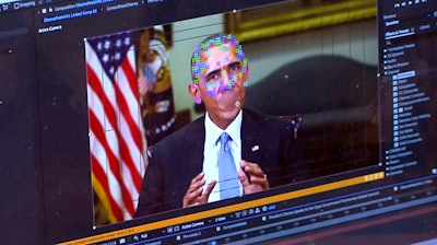 This image made from video of a fake video featuring former President Barack Obama shows elements of facial mapping used in new technology that lets anyone make videos of real people appearing to say things they've never said. There is rising concern that U.S. adversaries will use new technology to make authentic-looking videos to influence political campaigns or jeopardize national security.